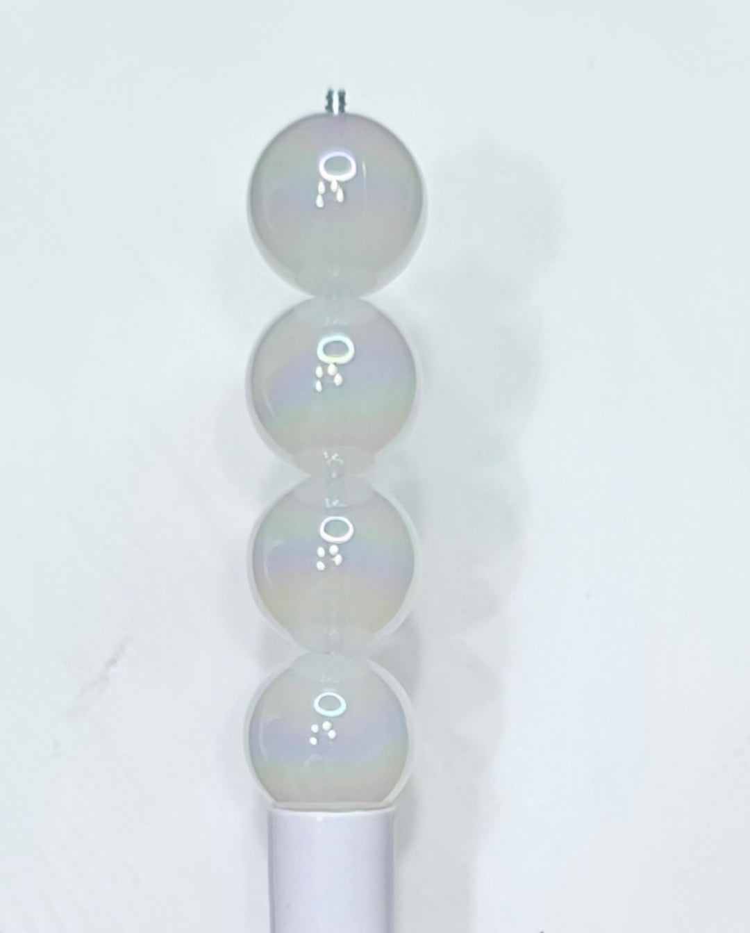 Glow in the dark white 16mm acrylic beads.