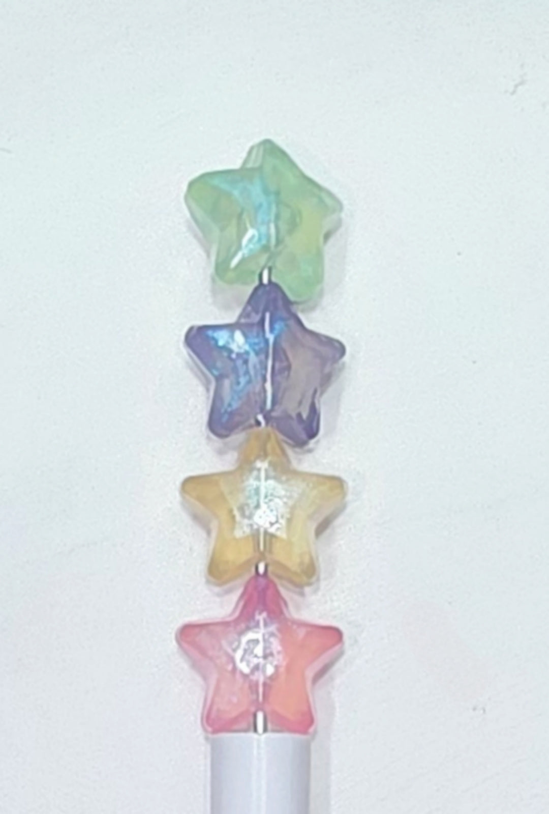 Glow in the dark glitter acrylic star beads. 8pcs randomly packed